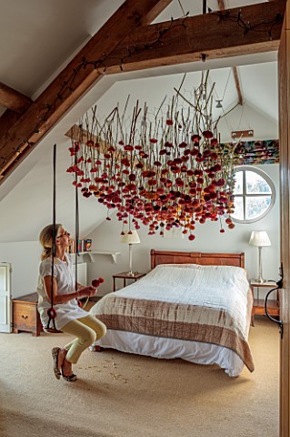 JUST_DAHLIAS_CHESHIRE_BEDROOM_WITH_DAHLIA_INSTALLATION_ABOVE_BED_BY_PHILIPPA_STEWART