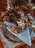 BABYLON FLOWERS, OXFORDSHIRE - SMALL COPPER WREATH USED AS TABLE SETTING, PINE CONES, HYDRANGEA HEADS, TWIGS, CONTORTED HAZEL, FERNS, CHRISTMAS
