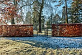 MORTON HALL, WORCESTERSHIRE: MEADOW, BEECH HEDGES, HEDGING, GATES, WINTER, JANUARY