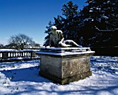 THE DYING GLADIATOR STATUE COVERED IN SNOW AT ROUSHAM PARK OXFORDSHIRE