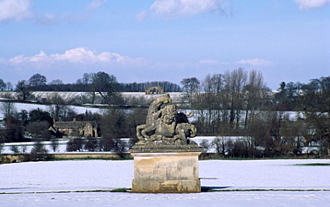 VIEW_FROM_THE_BOWLING_GREEN_PAST_THE_STATUE_OF_A_LION_AND_A_HORSE_TO_THE_3_ARCHED_SHAM_RUIN_ROUSHAM_